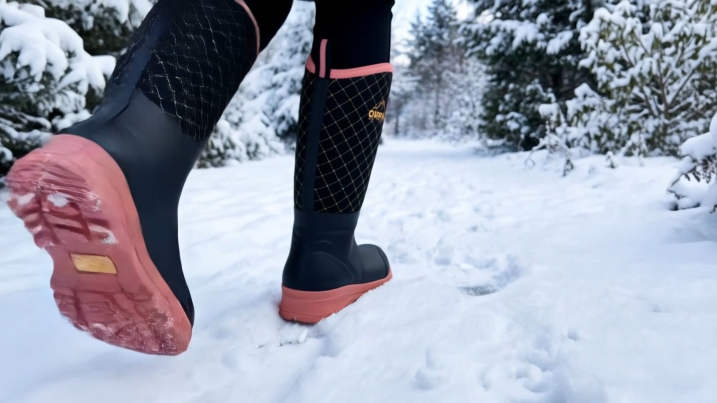 Tall boots with coral soles walking in snow